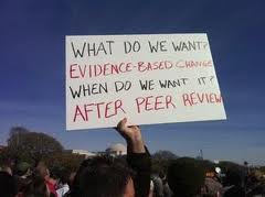 Peer review protest placard