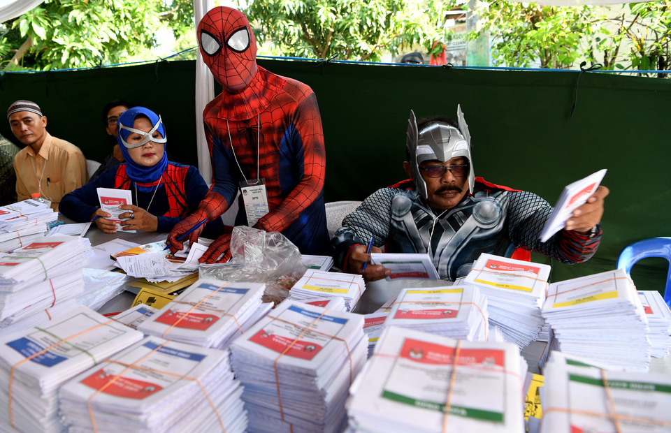 Counting votes dressed as superheroes